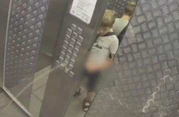 Russian Kid pisses on elevator control panel and gets stuck